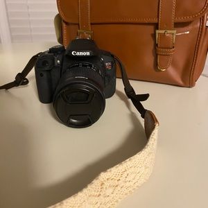 Rebel T5i with 18-55mm lens camera bag with small paint mark and camera strap